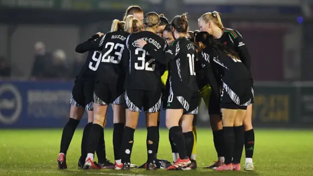 layers of Arsenal huddle ahead of the second half during the Subway Women's League Cup match between Brighton & Hove Albion and Arsenal