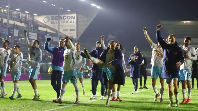 Burnley players celebrate after the 5-0 win at Plymouth