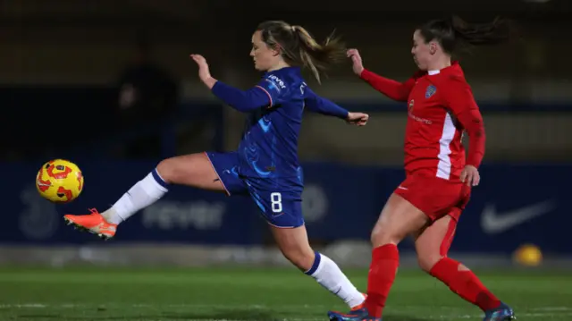 Erin Cuthbert of Chelsea is challenged by Eleanor Ryan-Doyle of Durham during the Subway Women's League Cup match between Chelsea and Durham