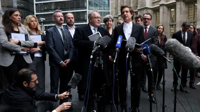 Lawyer David Sherborne, flanked by former Deputy Leader of the Labour Party Tom Watson, gives a media statement outside the Rolls Building