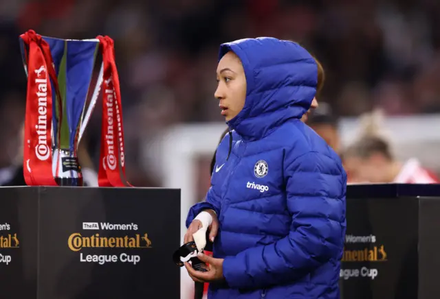 Lauren James walks past the trophy after collecting her runners up medal