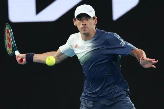 Alex de Minaur hits a forehand