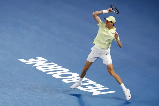 Jannik Sinner fires a forehand