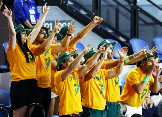 Alex de Minaur fans wearing the green and gold of Australai