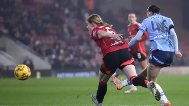 Lily Murphy of Manchester City scores her team's second goal during the Subway Women's League Cup match between Manchester United and Manchester City