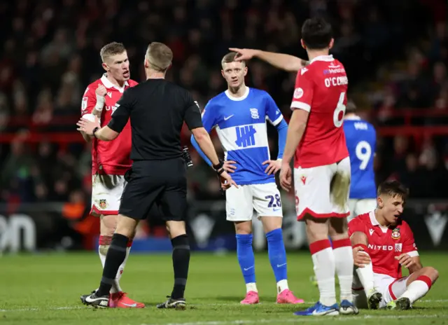 The referee talks to James McClean