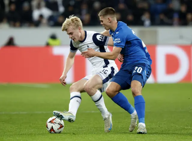 Bergvall holds off a challenge from a Hoffenheim counterpart