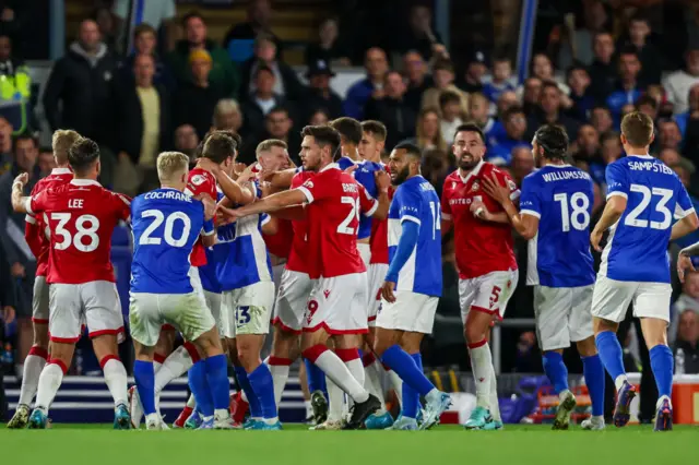 15 Wrexham and Birmingham players in a scuffle during the match in September