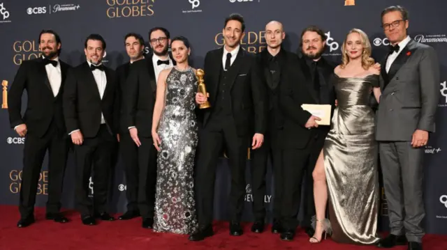 The cast of The Brutalist on the red carpet at this year's Golden Globes