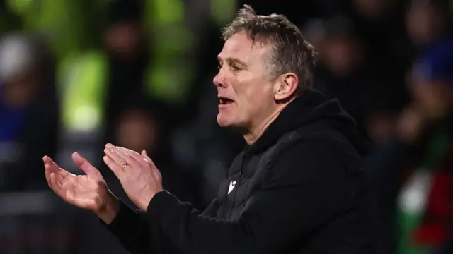 Phil Parkinson applauds