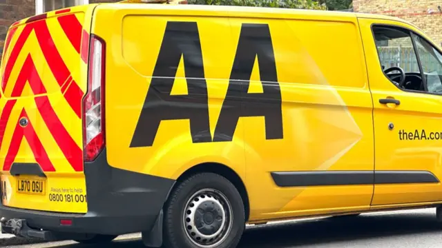 A yellow AA Van