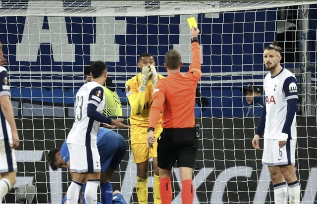 Tottenham Hotspur's Brandon Austin is shown a yellow card