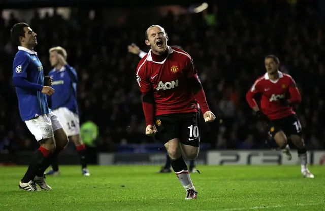 Wayne Rooney celebrates his 87th-minute penalty at Ibrox