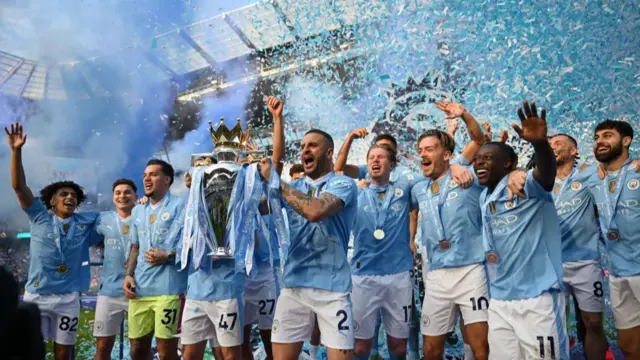 Kyle Walker lifts the 2023-24 Premier League trophy