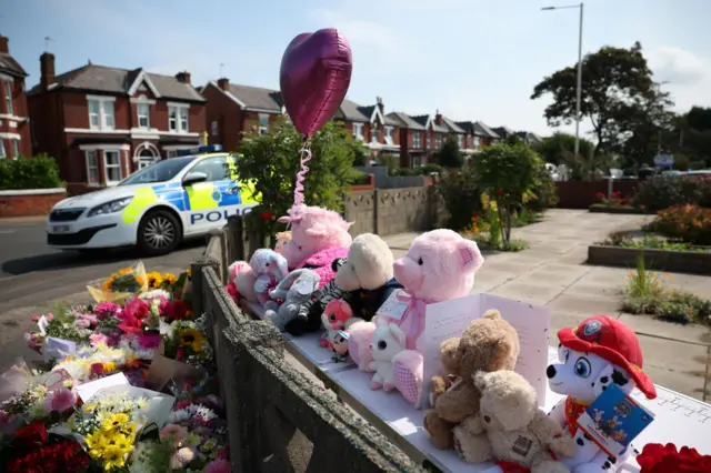 Tributes in Southport last year, near the scene of the attacks