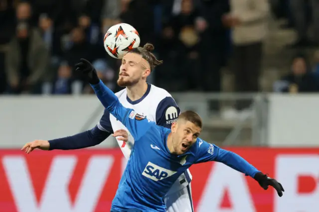 Dragusin and Kramaric duel for the ball in the air