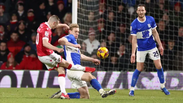 Wrexham's Paul Mullin has a shot blocked