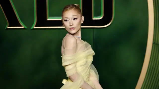 Ariana Grande in a green dress at Wicked premier