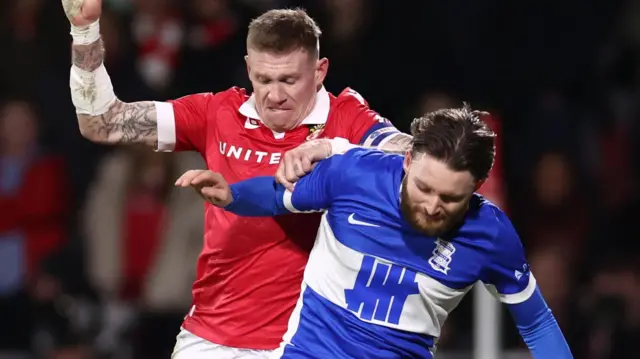 James McClean (left) of Wrexham challenges Birmingham City's Alfie May