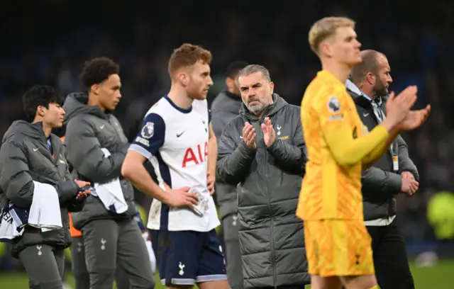 Tottenham players and staff clap the away end at Goodison Park