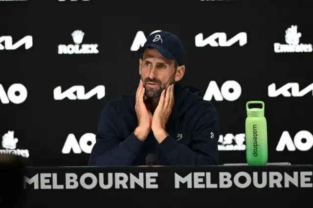 Novak Djokovic attends a press conference after the men's singles semi-finals