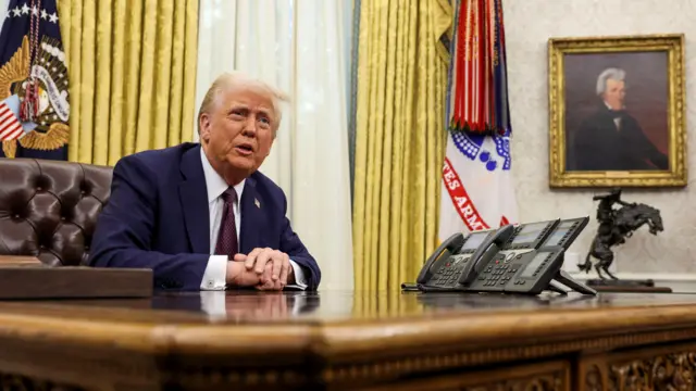 Trump speaking from a desk in the Oval Office