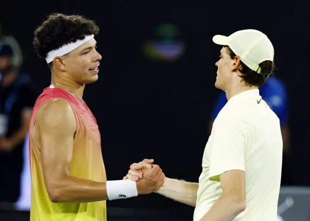 Jannik Sinner shakes hands with Ben Shelton