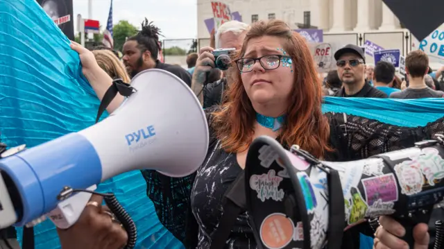 Lauren Handy standing in a crowd during a rally