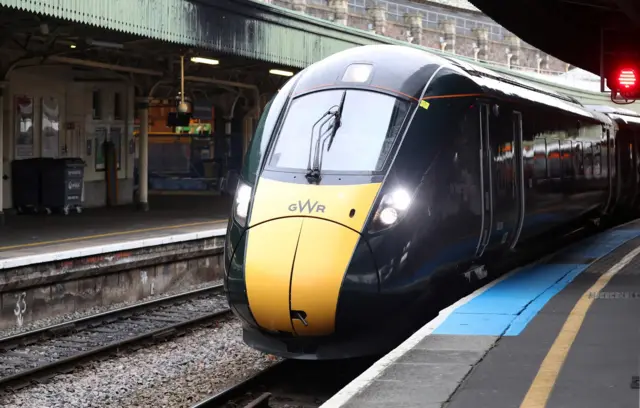 A picture of a GWR train at a station platform.