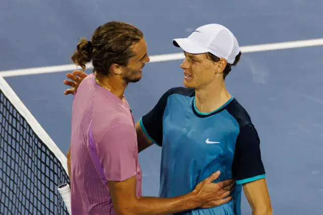 Jannik Sinner of Italy shakes hands with Alexander Zverev of Germany