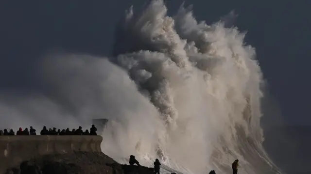 People view large waves as Storm Eowyn arrives in Porthcawl, Wales,