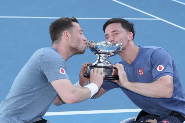 Britain's Alfie Hewett and Gordon Reid celebrate with their trophy