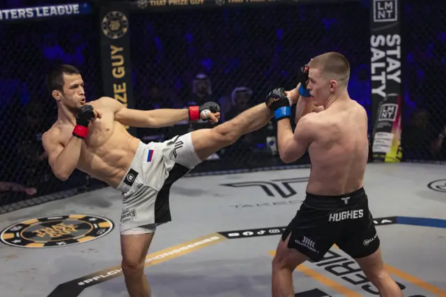 Usman Nurmagomedov aims a kick at Paul Hughes