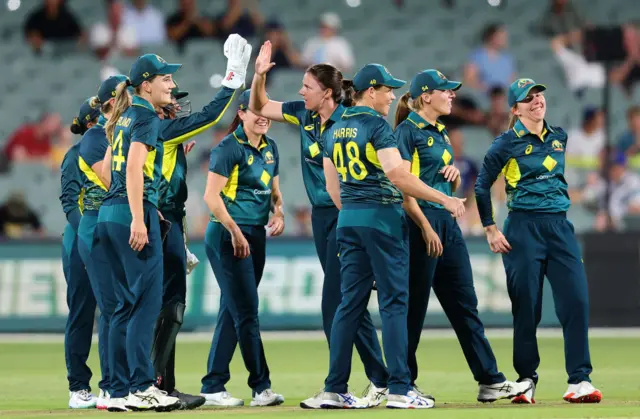 Australia celebrate a wicket against England