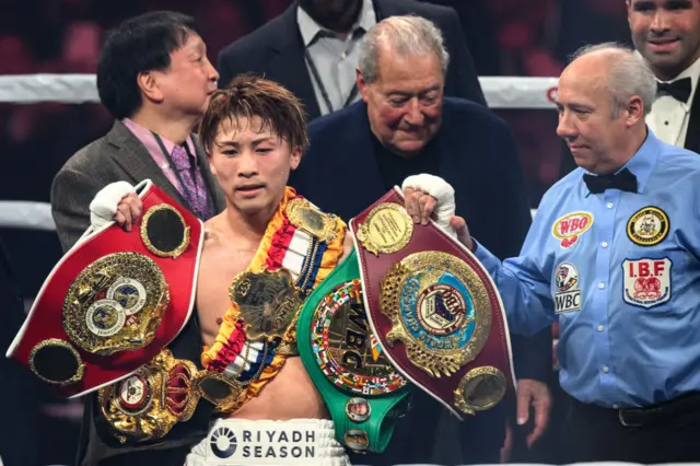 Naoya Inoue with his five world championship belts