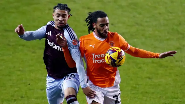 Dom Thompson playing for Blackpool against Aston Villa last month