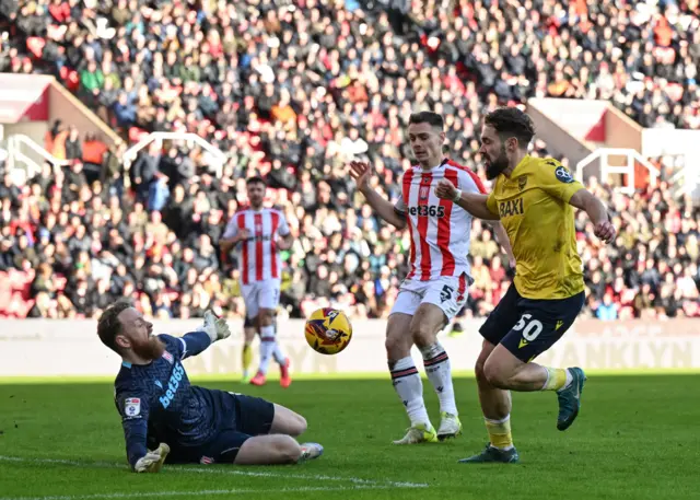 Oxford United's Tom Bradshaw shot on goal is saved by Stoke City's Viktor Johansson