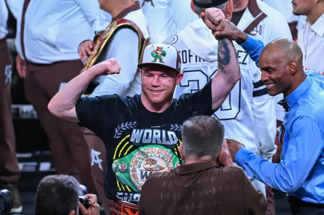 Canelo Alvarez with his arm raised