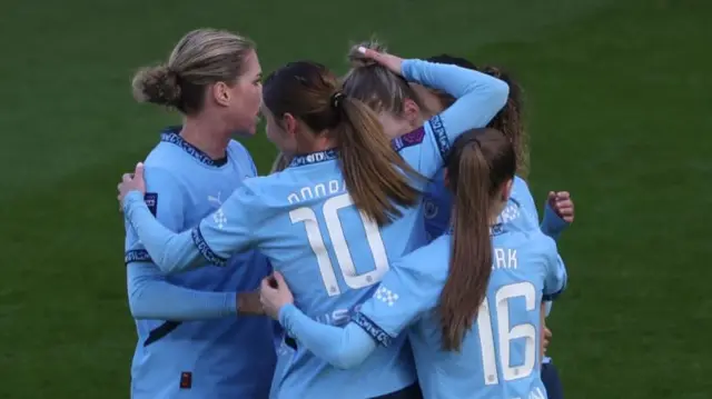 Man City players celebrate Miedema's goal