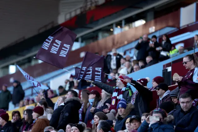 Villa fans wave flags in the stands