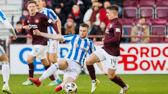 Kilmarnock's Liam Polworth tackles Hearts' Cammy Devlin