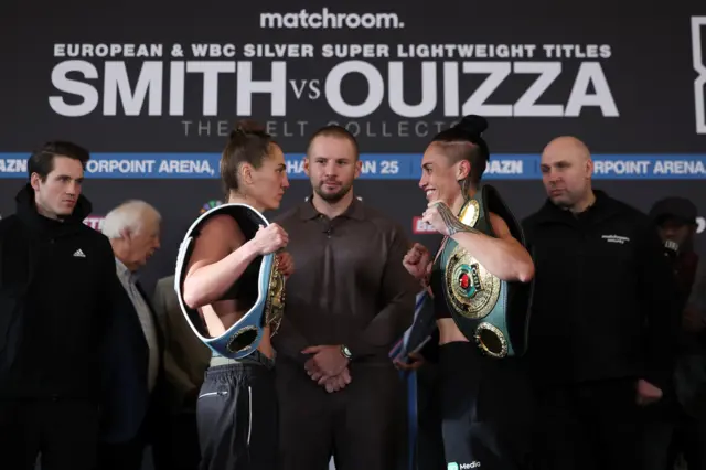 Ellie Scotney faces off with a smiling Mea Mout at a weigh-in