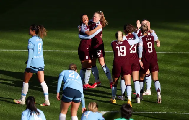 Villa players celebrate with Chasity Grant after her goal