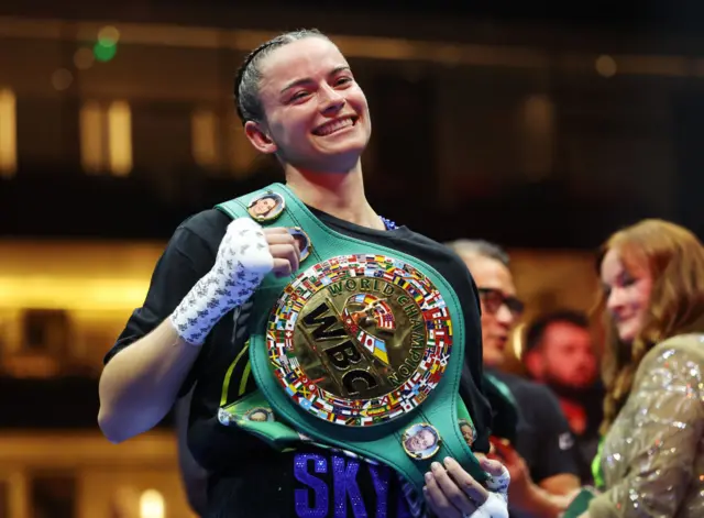 Skye Nicolson smiles with her WBC featherweight world title