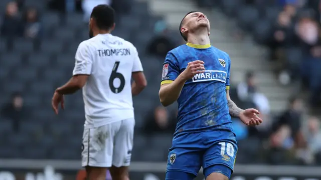 AFC Wimbledon's Josh Kelly looks on disappointed