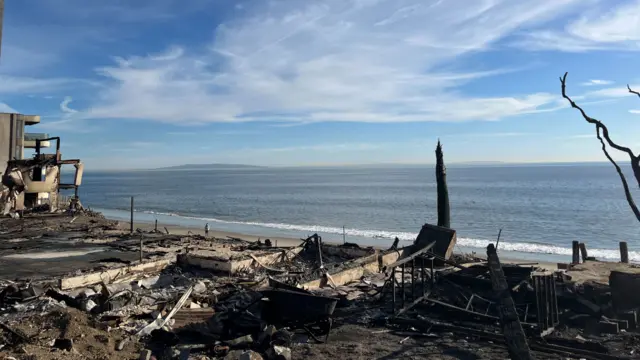 Charred remains of a home near the ocean