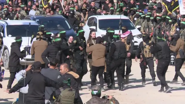 Prisoners walk through square