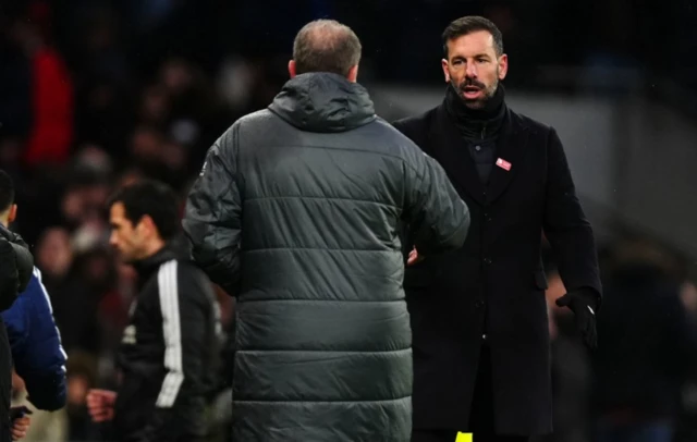 Tottenham Hotspur manager Ange Postecoglou and Leicester City manager Ruud van Nistelrooy shake hands