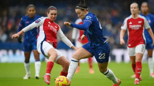 Mariona Caldentey of Arsenal challenges Lucy Bronze of Chelsea during the Barclays Women's Super League match between Chelsea FC and Arsenal FC at Stamford Bridge