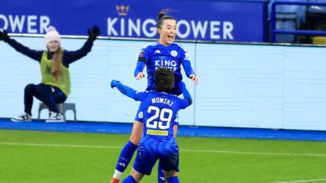 Missy Goodwin of Leicester City celebrates scoring her team's second goal with team mate Yuka Momiki during the Barclays Women's Super League match between Leicester City and Liverpool FC